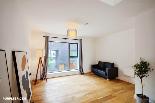The generous reception space flows naturally towards the kitchen, creating a flexible setting for modern everyday living