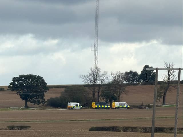 At least three police vans were pictured surrounding a small thicket of trees in a field off Worksop road in Aston on September 15, 2026.