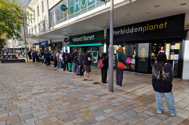 Fans queue at the Forbidden Planet shop on The Moor, for a Pokemon anniversary card drop. Photo: David Kessen, Iconic Media