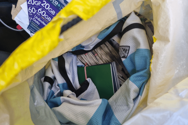 Bundles of cash and passports would later prove the gang was trafficking migrants then withholding their passports so they could be forced into paying while working at businesses like nail salons across the UK.