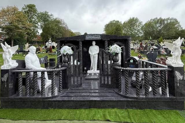 Standing at nine-and-a-half feet tall, the lavish memorial to Michael Collins features two life-like statues of him, along with a marble pint of Guinness, a pint glass bearing the initials “MC” and embossed depictions of a can of Diet Coke and a bottle of Budweiser.