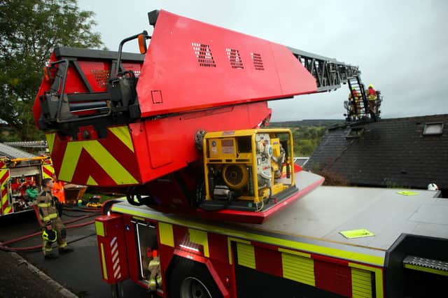 Firefighters on the aerial platform battling a fire on The Grove, Totley, Sheffield. Photo: South Yorkshire Fire and Rescue