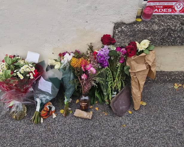 Floral tributes left at the scene of a fatal collision on Myrtle Road in Sheffield, where an ambulance hit a 26-year-old man on September 10, 2026.