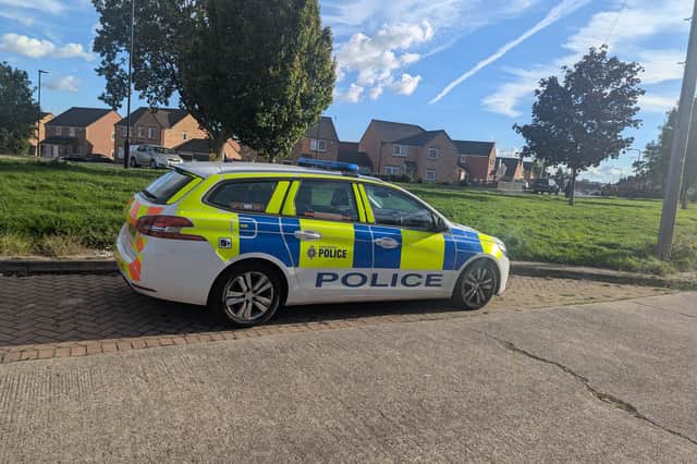 Police were called to a residential street this afternoon after reports of a man with a knife.