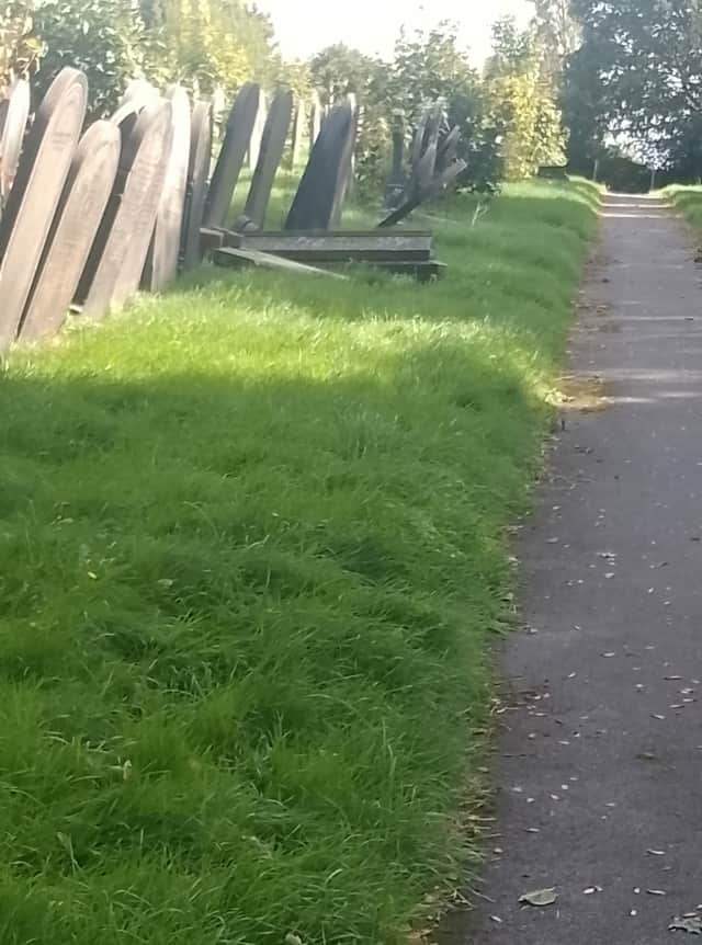 Graves toppled over and overgrown grass is the current state at Norton Cemetery.