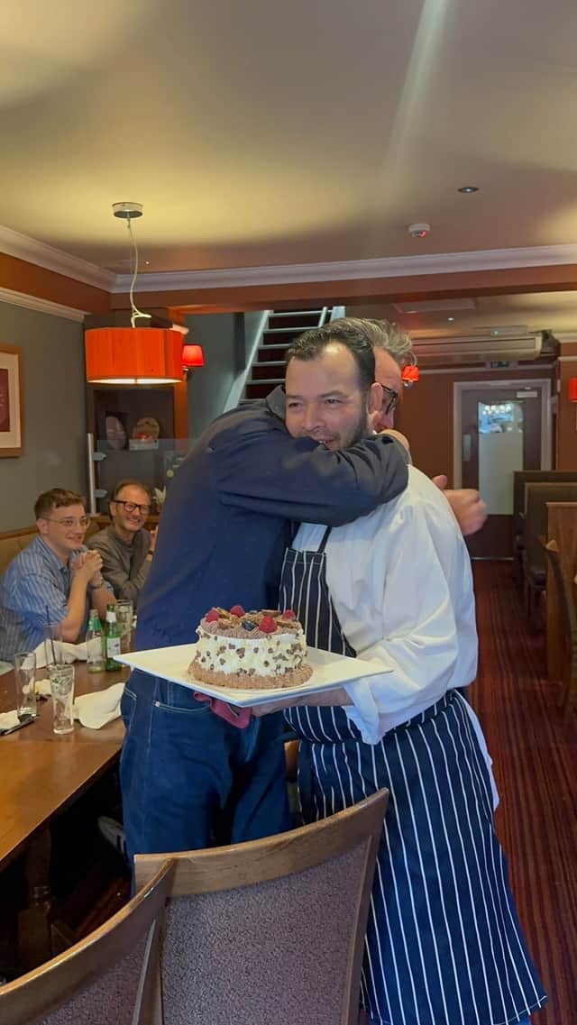 The Sheffield legend, Richard Hawley gives Prithiraj owner Sobuj Miah a hug after being surprised by gifts at the popular Ecclesall Road restaurant.