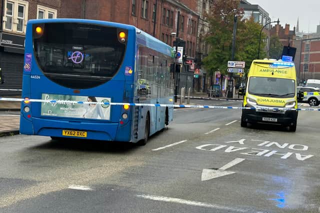 A police cordon is in place on Wicker, at the edge of Sheffield city centre, after a pedestrian suffered suspected life-altering injuries following a collision with a bus