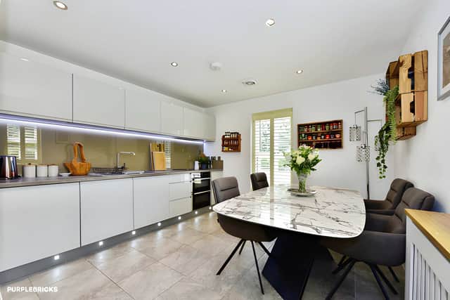 The well-proportioned kitchen provides generous space for everyday family life and entertaining at the rear of the home
