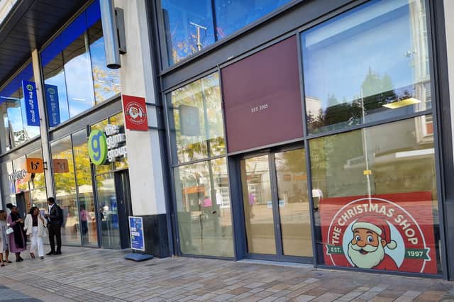 Signs for The Christmas shop, an annual seasonal retailer in Sheffield city centre, have gone up in the former Cardzone shop on The Moor. Photo: David Kessen, Iconic Media