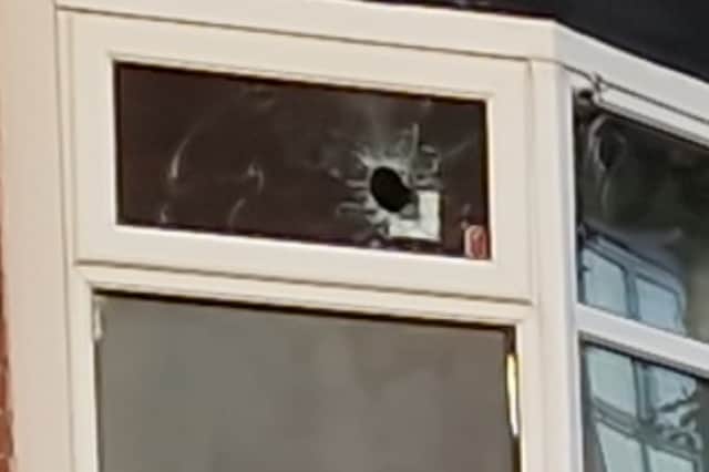 Picture shows a hole in a house window after a shooting on Elmham Road, Darnall, Sheffield. Photo: Iconic Media