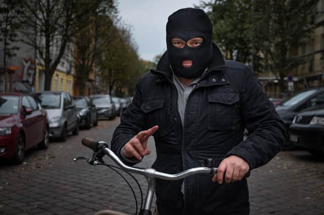 File picture shows a biker in a mask.