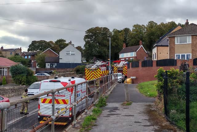 Firefighters at Dalton Lane, Rotherham on October 5, 2026, after a fire led to a road closure.
