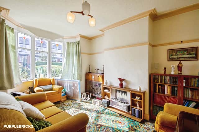 The ground-floor lounge sits within a two-storey layout with three bedrooms upstairs