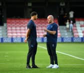 Mason Burstow, pictured left, with Owls boss Henrik Pedersen.