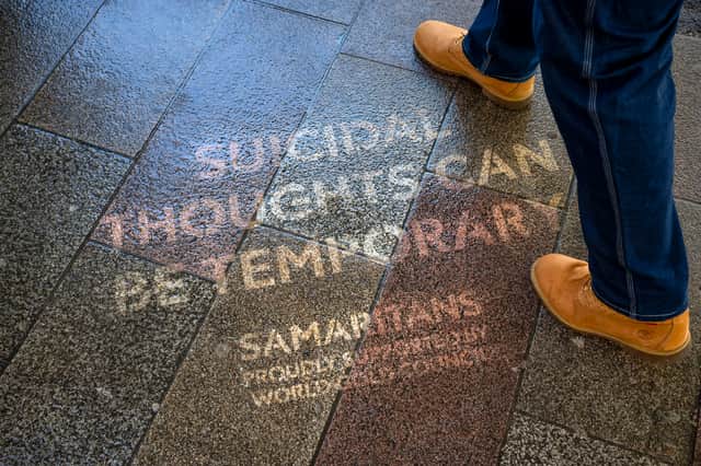 The quotes were made using reverse graffiti, and appear on pavements across London