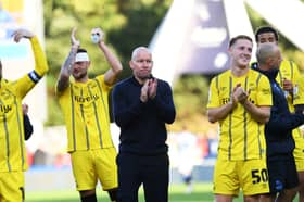 The Owls scored two late goals to draw at Huddersfield Town.
