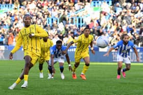 Jamal Lowe scored a 98th minute penalty equaliser for Wednesday at Huddersfield.