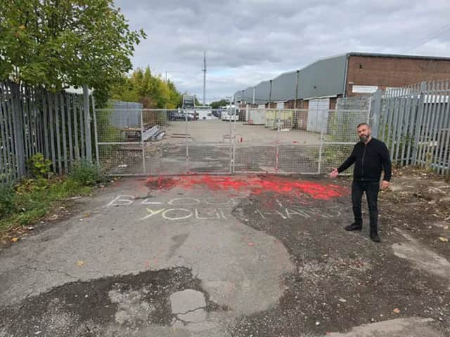 Councillor Mustafa Ahmed outside the depot