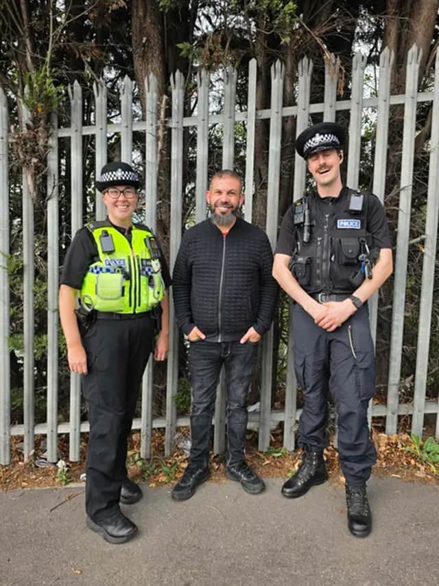 Councillor Mustafa Ahmed with police at the depot