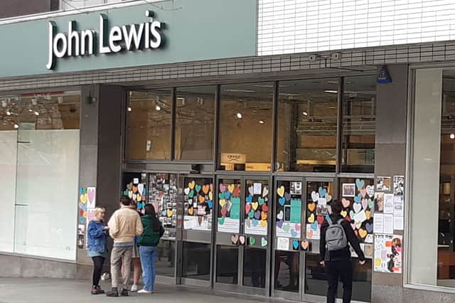 Messages on the doors of John Lewis after it closed in 2021.