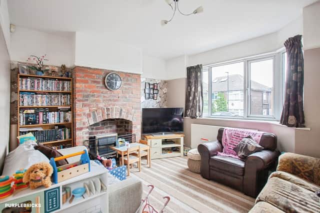 A generous separate lounge gives the ground floor a dedicated space for relaxing, complemented by a sizeable dining kitchen at the rear