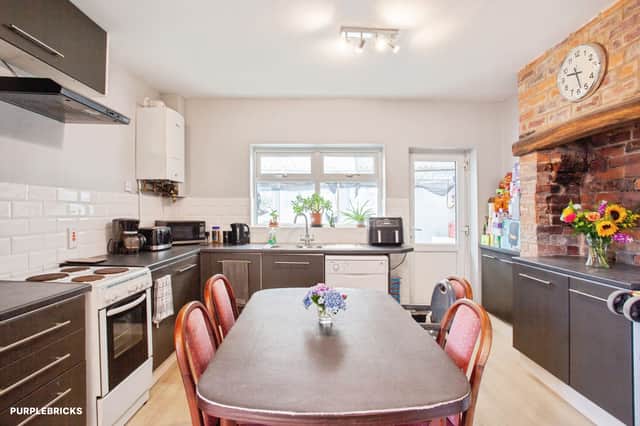The dining kitchen measures 5.05m by 3.95m, with ample cupboard and worktop space, room for a family table and a useful pantry