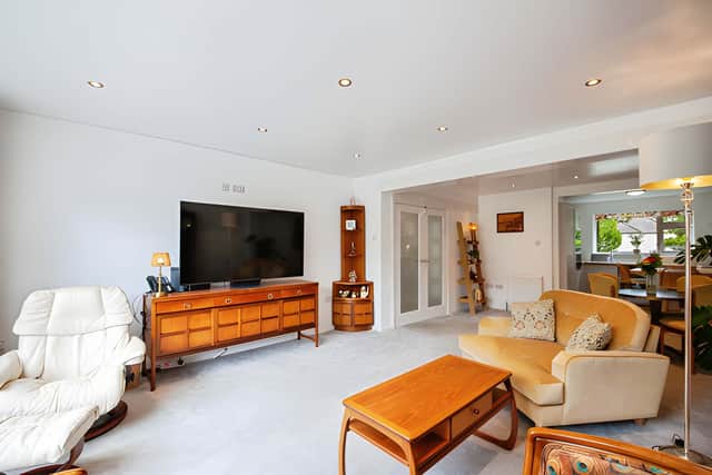 Large windows bring natural light into the 7.30m by 4.50m living and dining area, providing generous space for relaxing and entertaining