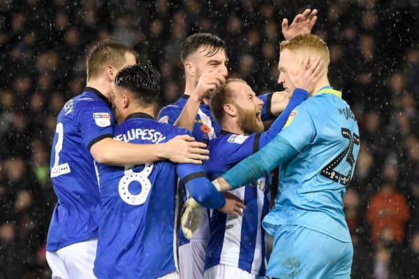 Owls goalkeeper Cameron Dawson is congratulated by his team-mats after saving David McGoldrick’s penalty in 2018.