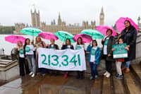 Members of Mums for Lungs opposite the Houses of Parliament highlighting the 213,000 children hospitalised across English cities with breathing problems. 