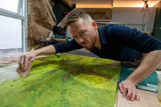 Marquetry is a type of art that involves applying thin pieces of veneer and wood to a structure's surface to create decorative patterns.