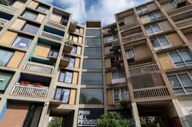The contrast between the old and new blocks is stark