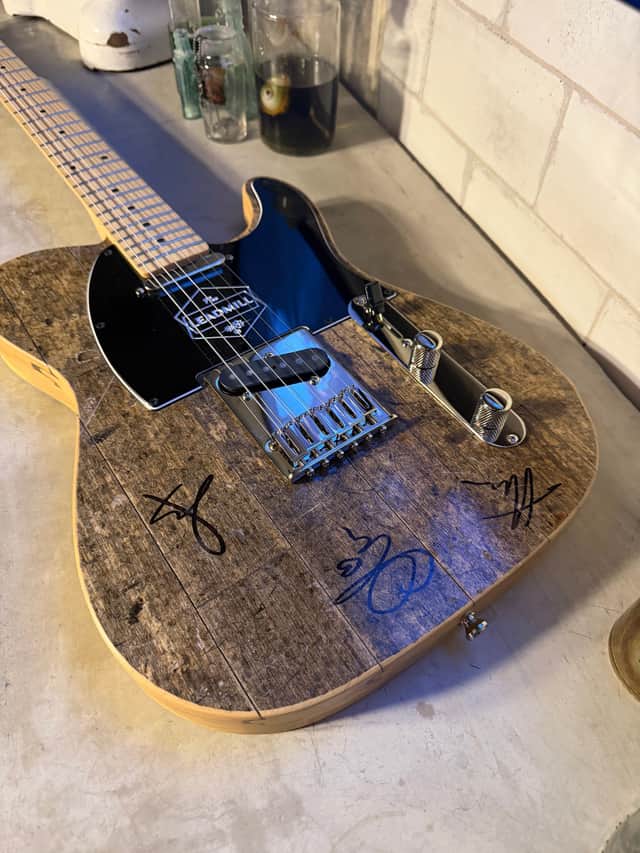 The prize guitar has been signed by Bring Me The Horizon and is actually made from The Leadmill's original dancefloor.