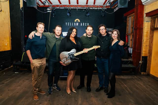 Lara Disco was presented with her guitar by Joe Carnall Jnr of Milburn at Yellow Arch Studios earlier this year.