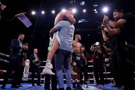 Dalton Smith (centre left) embraces his coach as he celebrates after being announced as the winner of the WBC World Super Lightweight Title Contest against Alberto Puello at Utilita Arena Sheffield.