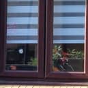 A bullet hole in the window of the Sheffield home
