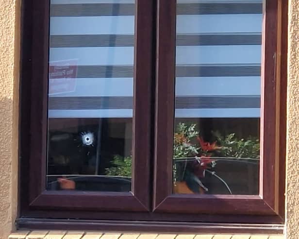 A bullet hole in the window of the Sheffield home