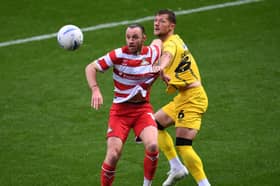 Liam Cooper in action against Doncaster Rovers.