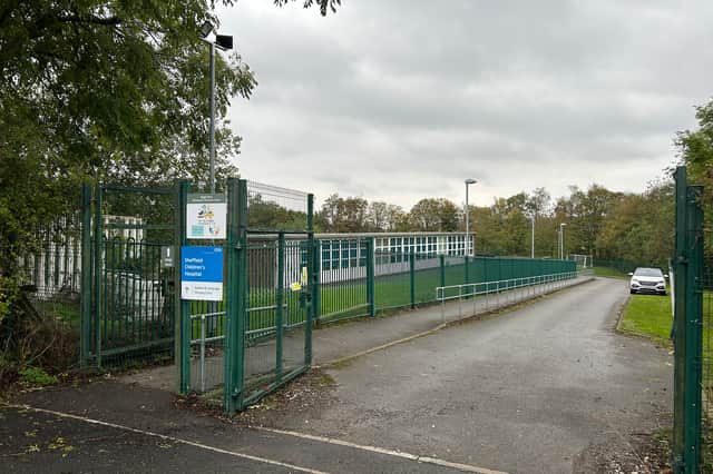 Hugi Nest and the NHS speech and language therapy centre are separated from the field by a line of trees