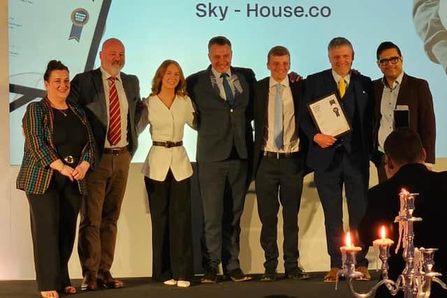 The Sky-House team with their award.