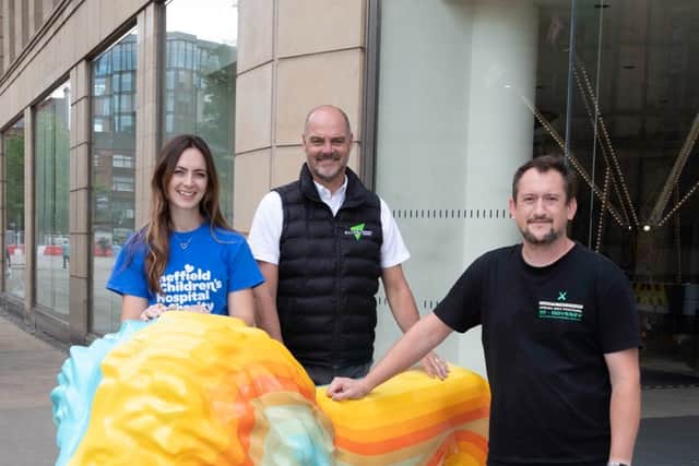 L-R Sophie Coburn, Corporate Partnerships Manager at the Sheffield Children’s Hospital Charity, Aliva UK’s Regional Sales Manager for the North Andy Fletcher with OutLion’s artist Rob Lee.