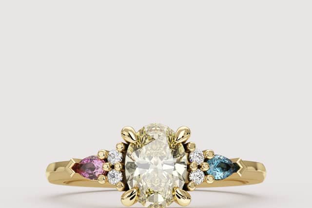 Janelle - inspired by the pansexual flag, a central yellow lab grown diamond and pear cut pink and blue sapphires