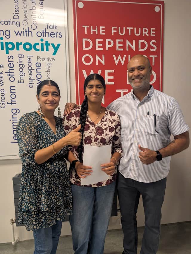 Sudi celebrating her results with her family by her side.