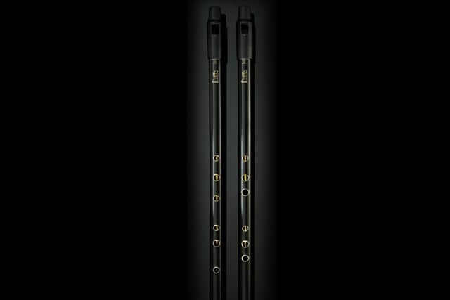 The traditional Low D Whistle (left) and the re-designed version for improved playability (right)