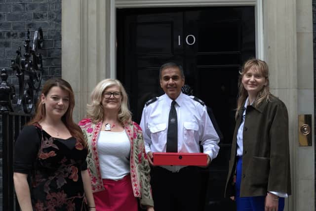 MVM’s Molly Maguire, Emma Harrison and Ana Oppenheim (L-R) delivering the letter to 10 Downing Street