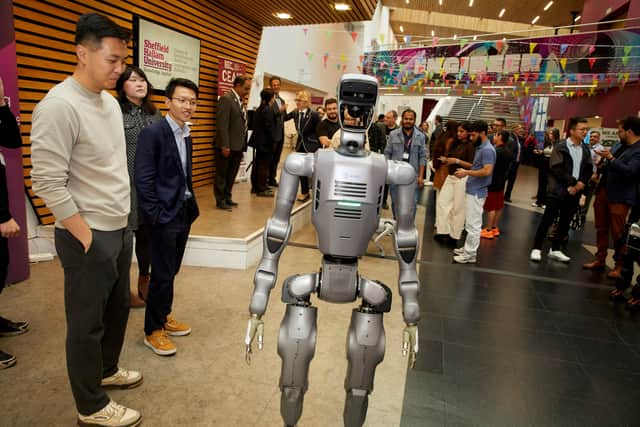Robot and people gathered at the event
