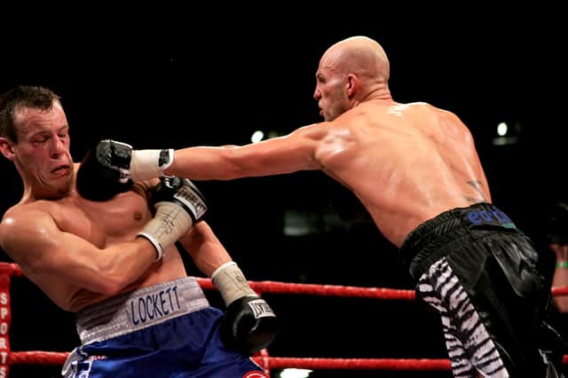 CARDIFF, WALES - JULY 8: Gary Lockett (L) is caught by a left jab during the WBU Middleweight title fight against Ryan Rhodes at The Millennium Stadium on July 8, 2006 in  Cardiff, Wales. (Photo by John Gichigi/Getty Images)