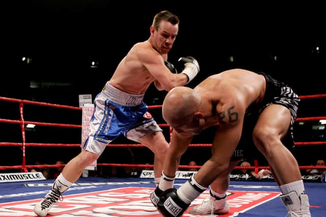 CARDIFF, WALES - JULY 8: Gary Lockett (L) almost drops his opponent during the WBU Middleweight title fight against Ryan Rhodes at The Millennium Stadium on July 8, 2006 in  Cardiff, Wales. (Photo by John Gichigi/Getty Images)