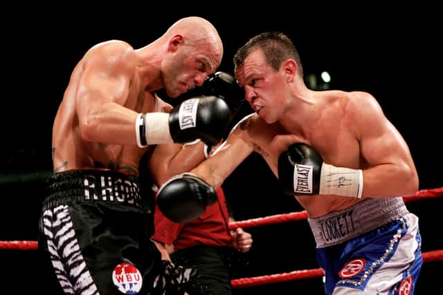 CARDIFF, WALES - JULY 8: Gary Lockett (R) throws a right cross during the WBU Middleweight title fight against Ryan Rhodes at The Millennium Stadium on July 8, 2006 in  Cardiff, Wales. (Photo by John Gichigi/Getty Images)
