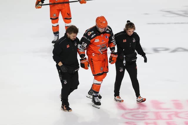 Dominic Cormier helped off the ice by the clubs medical staff, he did return to the game