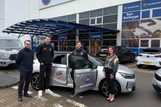 Tim Gettinger and club captain Robert Dowd collecting their new cars from Motorpoint